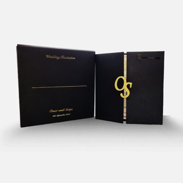 black and gold book opening shaadi card