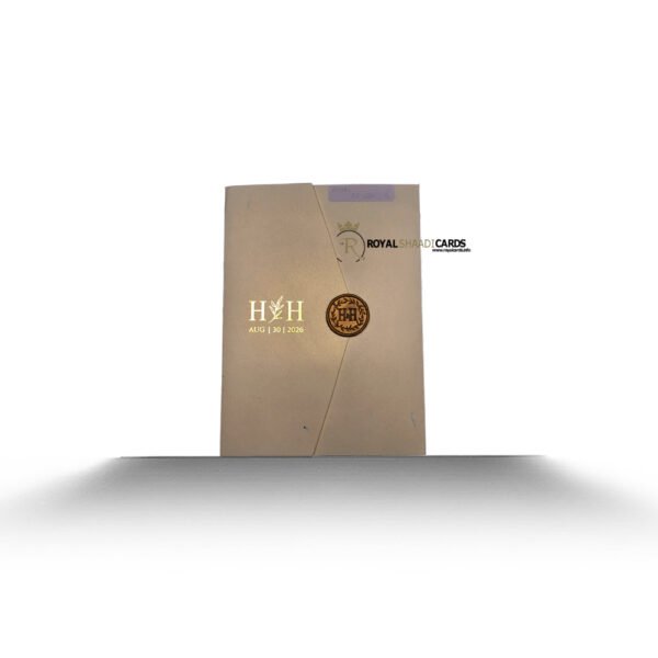 Cream shaadi card with initials and stamp